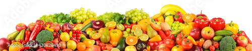 Wide panoramic set of ripe  juicy fruits  berries and vegetables isolated on white