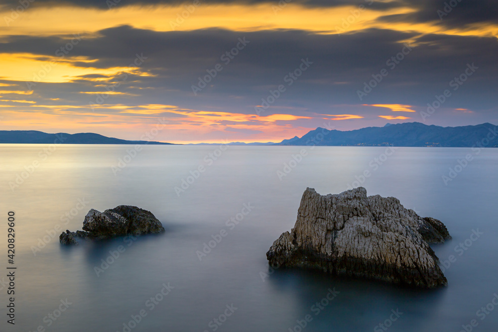 Sunset on adriatic sea in Croatia, Makarska riviera, Croatia