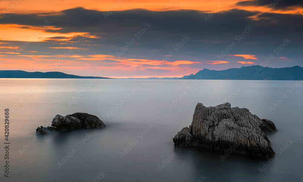 Sunset on adriatic sea in Croatia, Makarska riviera, Croatia