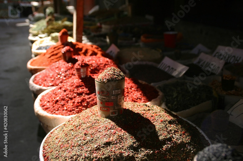 Osh, Kyrgyzstan - 10.09.2019: Local food and spices in Osh bazar, the main market in Bishkek. Photo with copy space photo