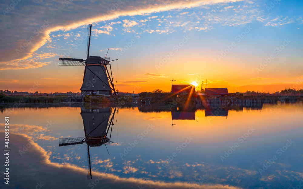 traditional dutch windmills and houses near the canal ,Holland, Europe, gold windmills, old ,
