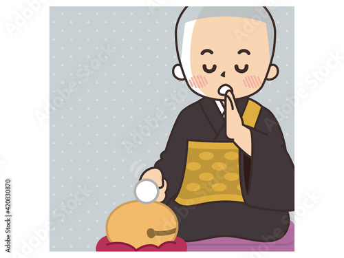木魚を叩きながらお経を詠む住職