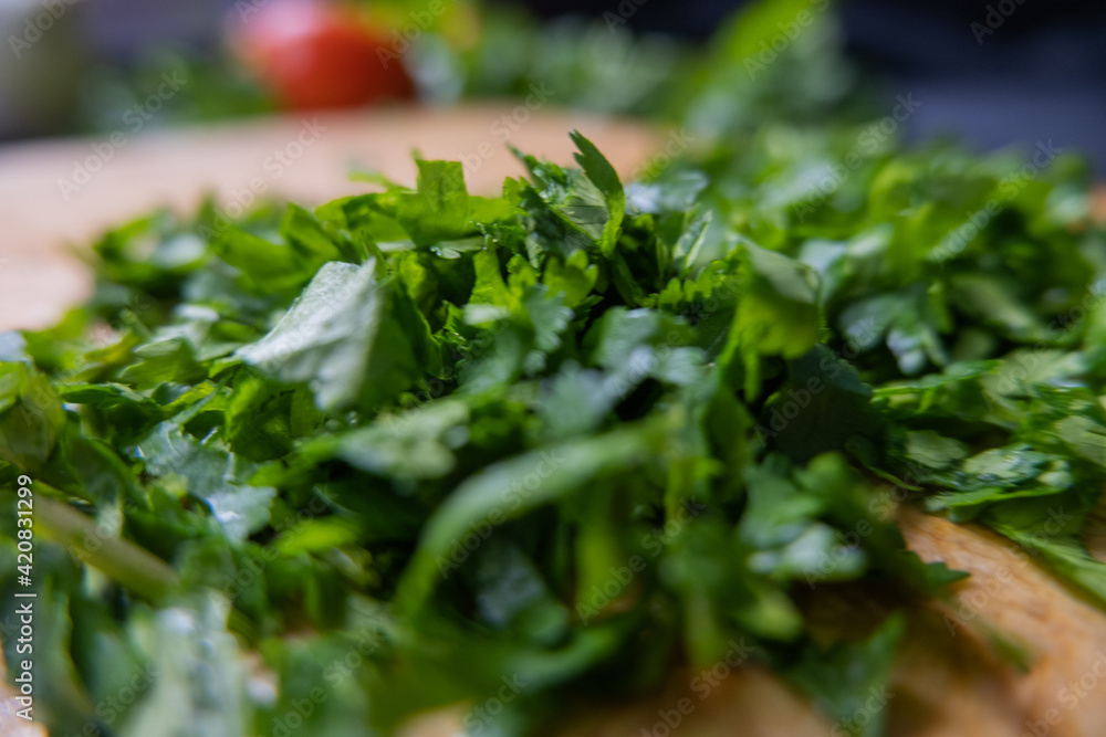 Close-up of chopped coriander on a cutting board Close-up of chopped coriander on a cutting board