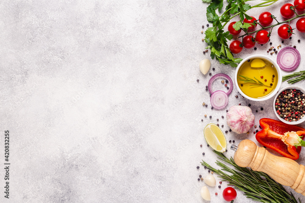 Herbs and condiments on light stone background. Stock Photo | Adobe Stock