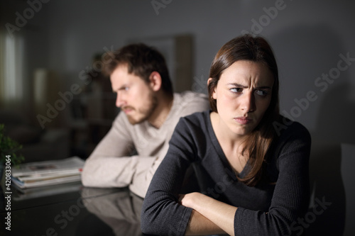 Angry couple ignoring each other at home in the night © PheelingsMedia