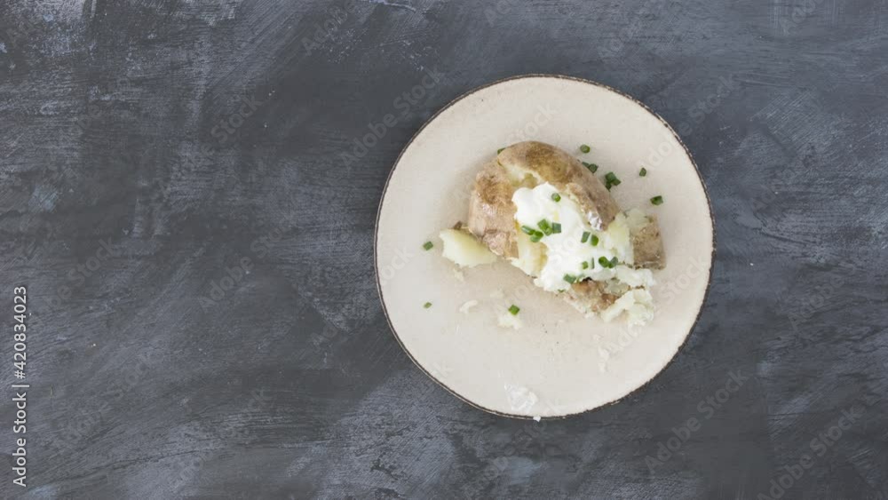 Stop Motion Animation of Building and Eating a Baked Potato with Sour Cream and Chives Stop Motion Animation of Building and Eating a Baked Potato with Sour Cream and Chives