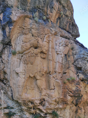 The world's first agricultural rock relief.The Storm God Tarhundas and the king of the region Varpalavas are depicted.
Historical rock monument.