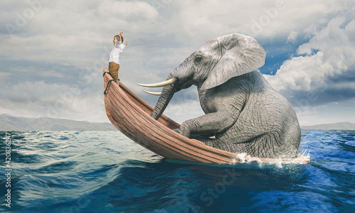 child on a shared boat with a big elephant.