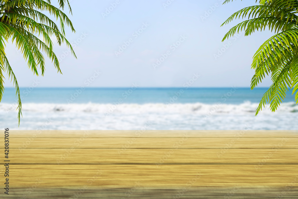 An empty wooden platform on the background of a seascape. Beach with palm trees. Empty space for your design. Summer concept