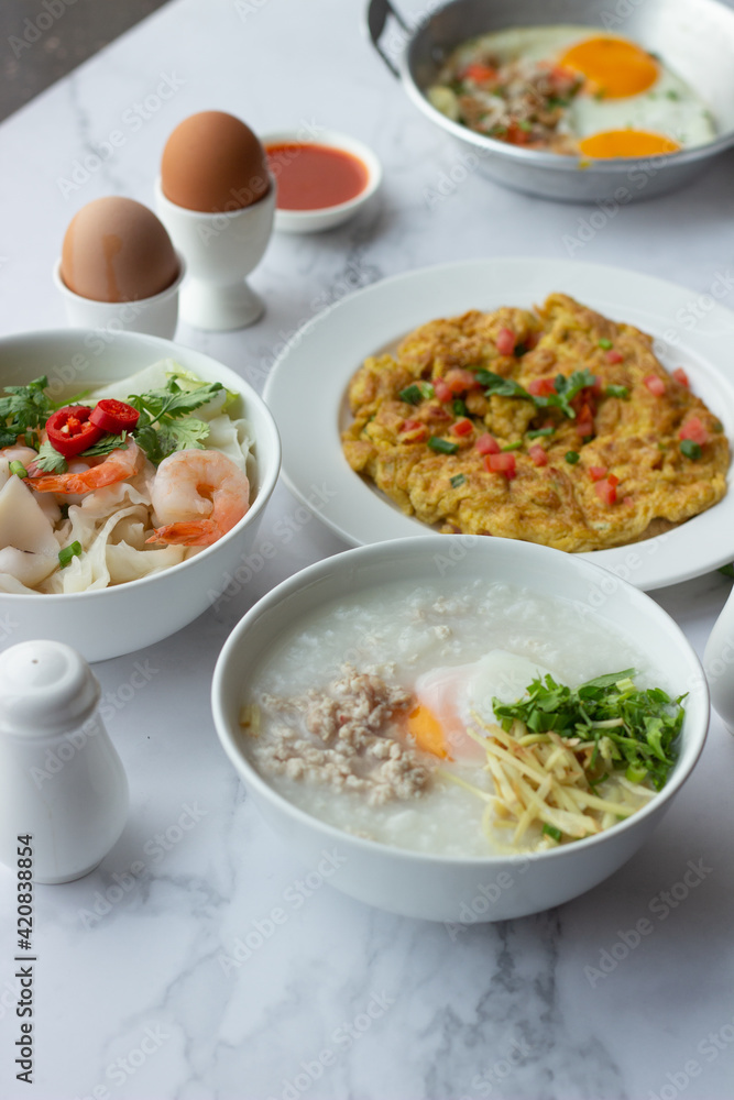 American and Thai breakfast set on the marble background