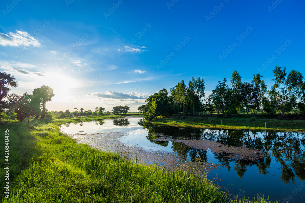 Landscape with Morning sunrise over the river in countryside.