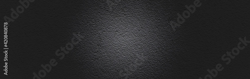 Banner of black asphalt texture. Wide black textured background. Shiny glossy dark panoramic surface