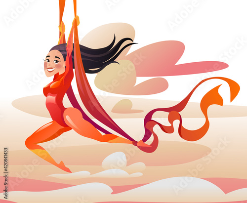 Acrobat on aerial silks. Flying girl against the background of the sky and clouds.