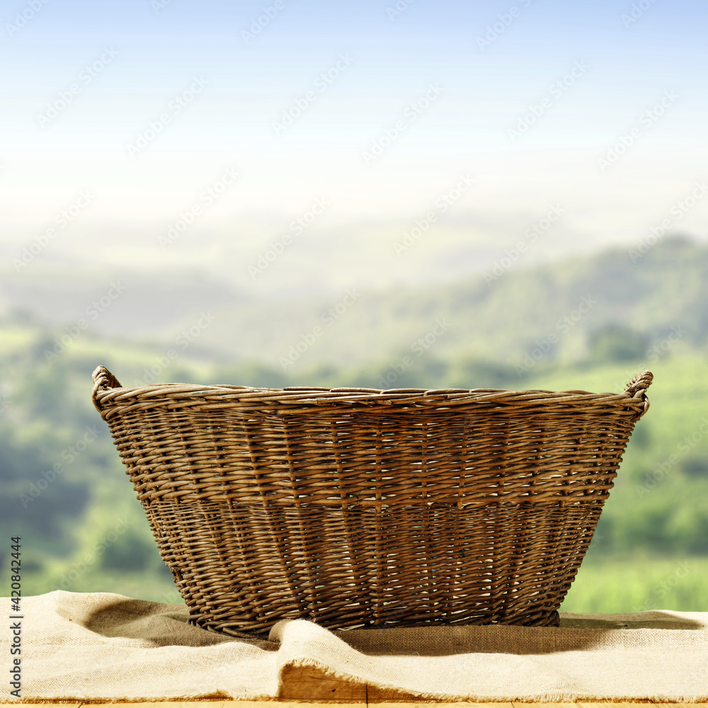 Empty wooden basket of free space for your decoration and spring blurred landscape Empty wooden basket of free space for your decoration and spring blurred landscape