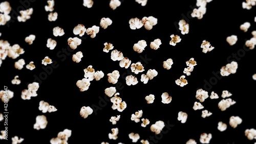 Flying many popcorns on black background. White salty popcorn. Healthy food. Corn seed. 3D loop animation of popcorn rotating.