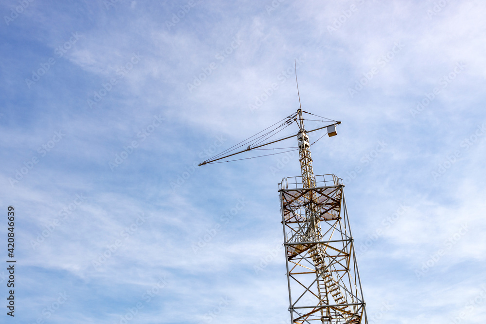 a tower for training parachute jumping against the background of the sky