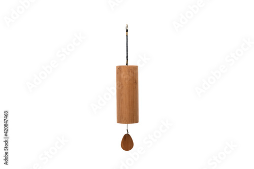 Close-up of a beautiful hand made Koshi chime musical instrument made from bamboo against pure white empty background. Koshi bell with crystalline relaxing sound. Copy space.