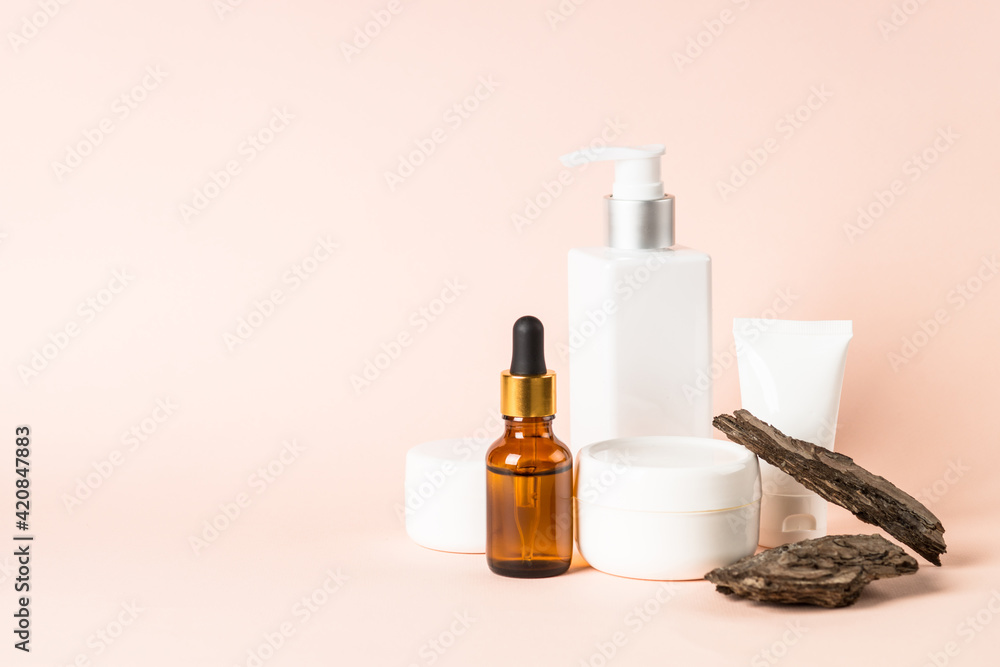 Skincare product with natural leaves and tree bark.