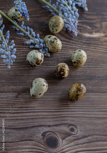 several quail eggs on a wooden table