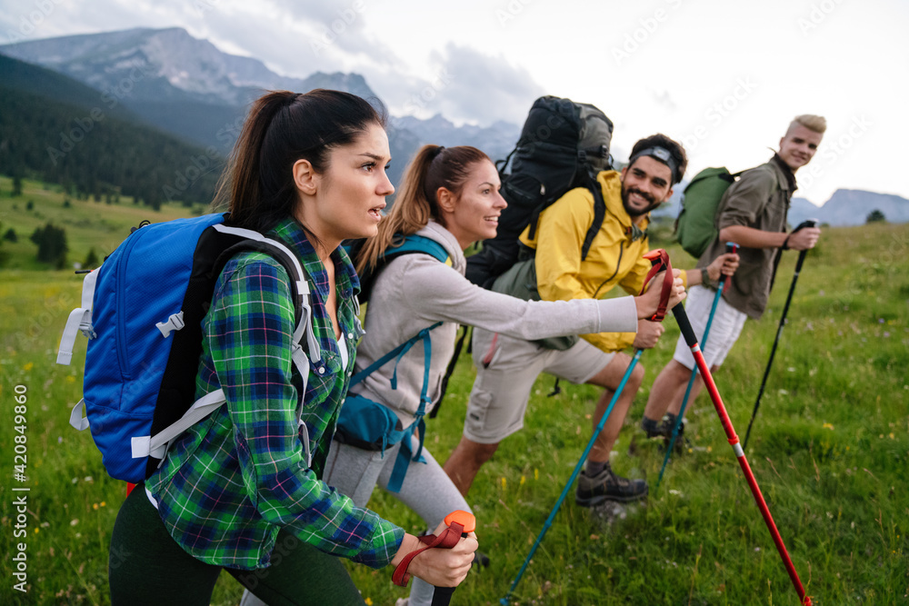 Group of friends on a hiking, camping trip in the mountains
