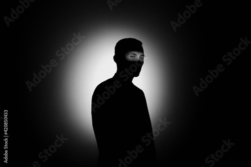 silhouette of a man in the dark.