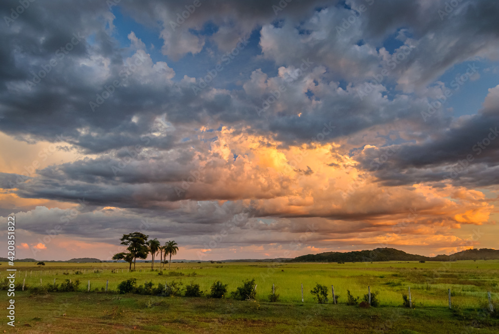 Bonito, Mato Grosso do Sul, Brazil on April 1, 2007. Meadow with sky full of clouds with sunset light.