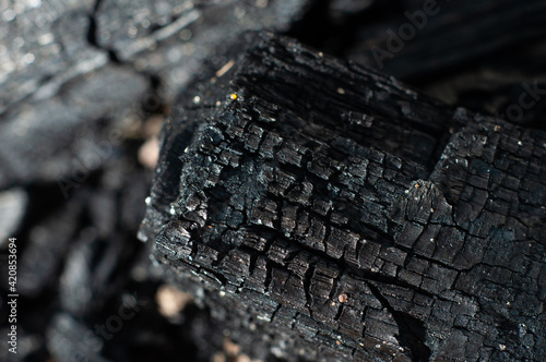 Fotografie Black charcoal close-up, macro photography