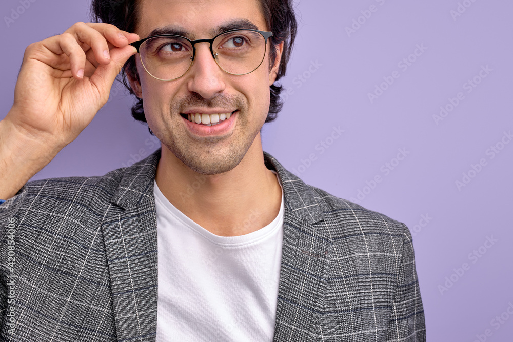 close-up portrait of smiling guy in suit wearing eyeglasses isolated on purple background close-up portrait of smiling guy in suit wearing eyeglasses isolated on purple background