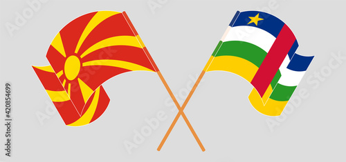 Crossed and waving flags of North Macedonia and Central African Republic