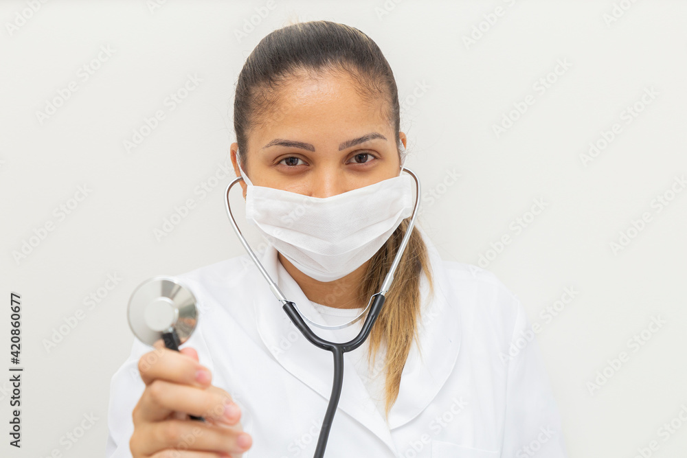 Mascara female doctor showing stethoscope. Mascara female doctor showing stethoscope.