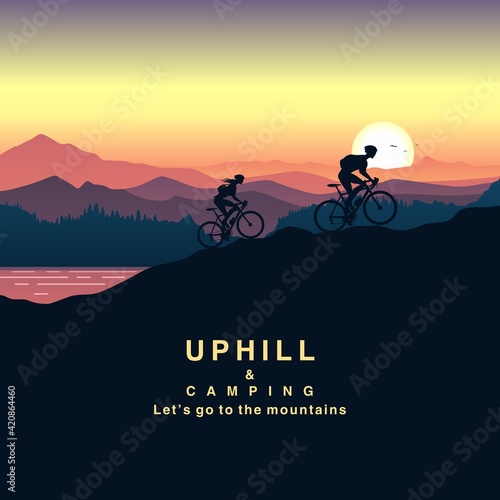 A group of campers climbing the mountain by bicycle at sunset. Couple on bike silhouettes and twilight scenery