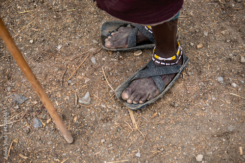 Recycled tires become a Maasai mans sandals in Tanzania, Africa
