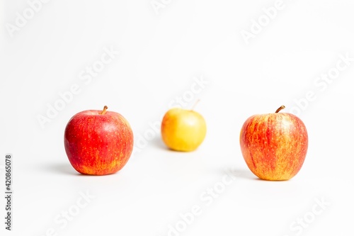 Red apples on a white background © LilianC