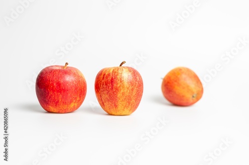 red apples on white background © LilianC