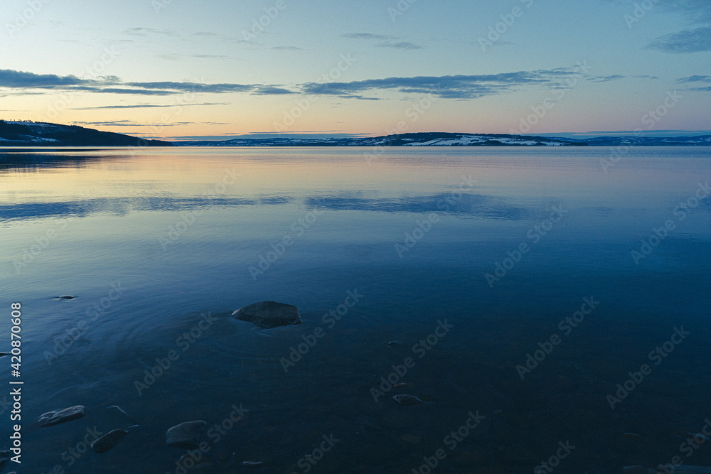 Lake Mjøsa seen from Totenvika Bay toward Helgøya Island in evening.