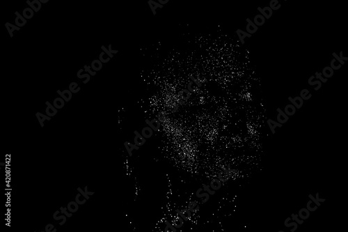 Silhouette of a girl's face with closed eyes drawn with white dots on a black background
