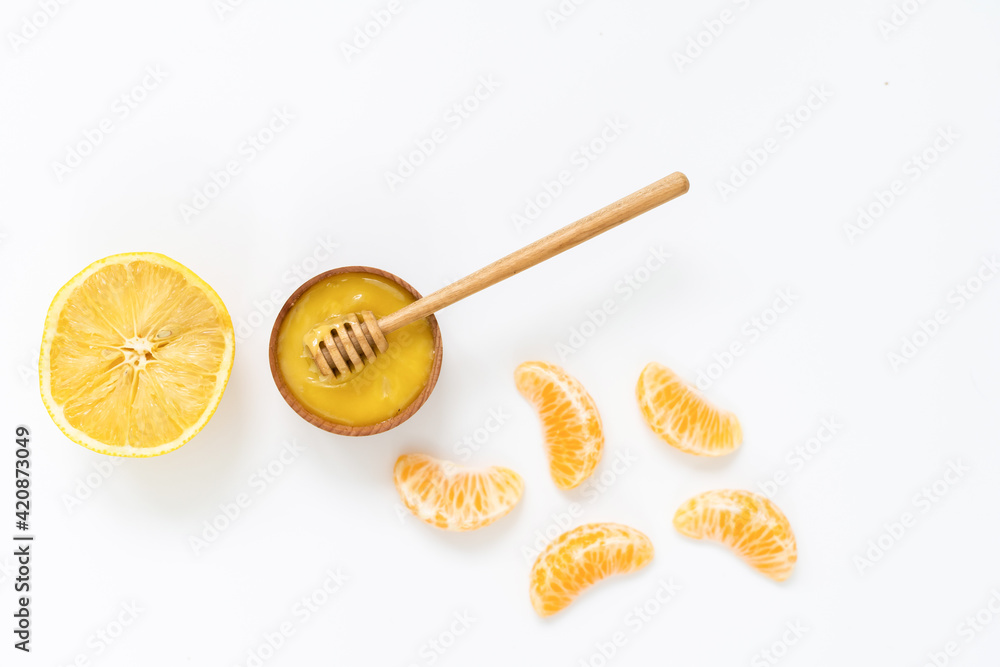 Bowl of honey on white background. Symbol of healthy living and natural medicine. Aromatic and tasty. Bowl of honey on white background. Symbol of healthy living and natural medicine. Aromatic and tasty.