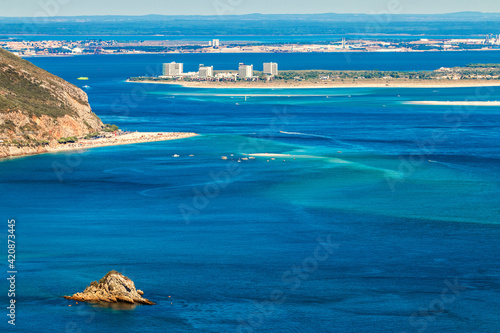Mouth of the Sado river in Portugal, with Figueirinha beach and the Troia peninsula seen from the viewpoint in Serra da Arrábida. photo