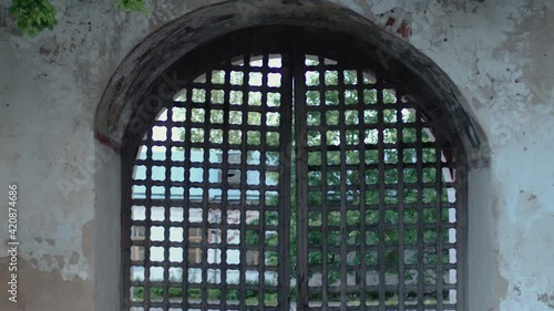 Antique iron gate with Old building wall