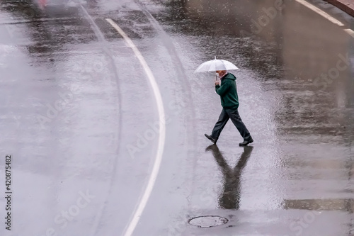 People walk on stret under rain photo