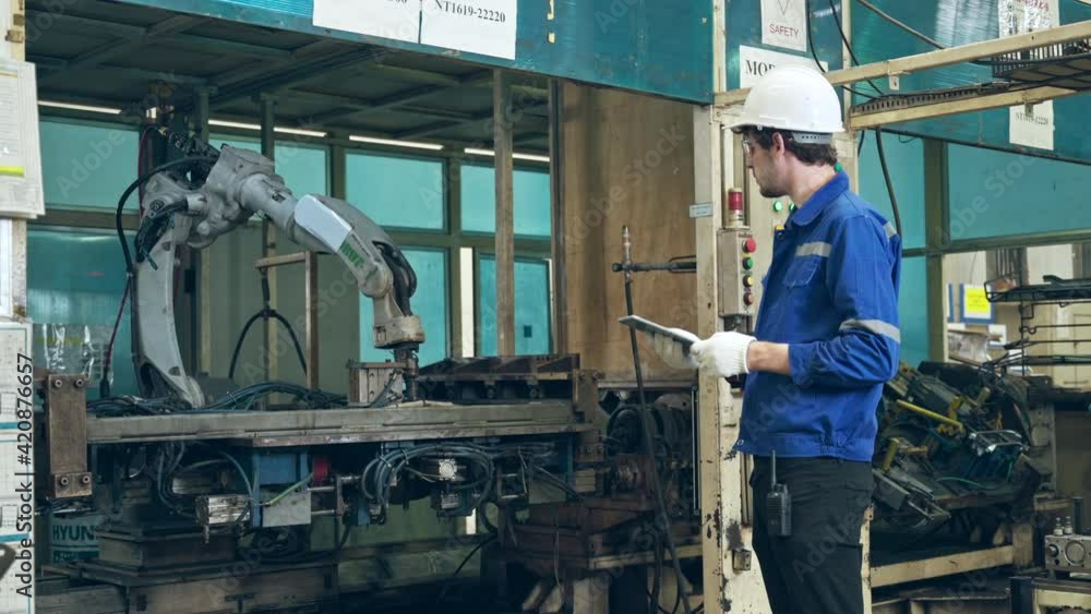 engineer control robot in factory engineer control robot in factory