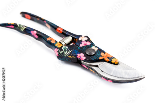 Garden secateurs with a flower pattern isolated on white background