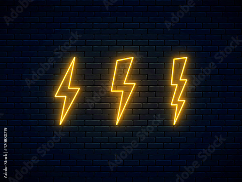 Neon lightning bolt set. Electric discharge symbol. High-voltage thunderbolt neon. Lightning, thunder and electricity sign. Banner design, bright advertising signboard elements. Vector illustration.