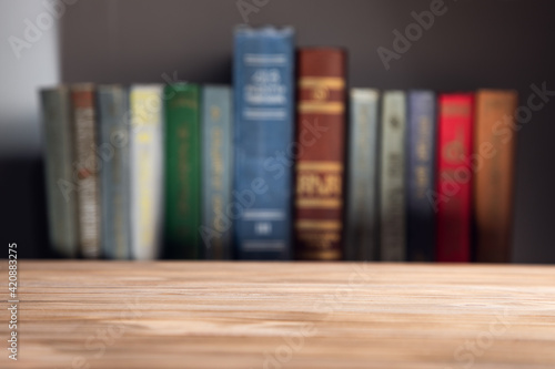 empty wooden table with books