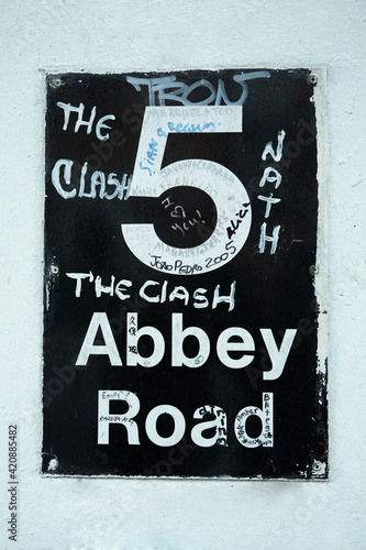 Abbey Road 5, where the Beatles produced many of their albums. The sign is smeared with graffiti. 