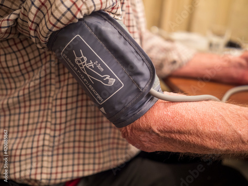 blood pressure check on man