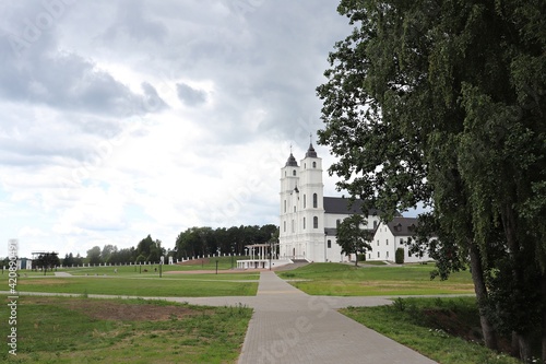 Catholic church stands against a gloomy sky in the Latvian village of Aglona on July 19, 2019