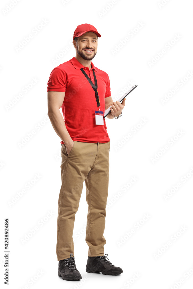 Full length portrait of a male shop assistant holding a clipboard and smiling Full length portrait of a male shop assistant holding a clipboard and smiling