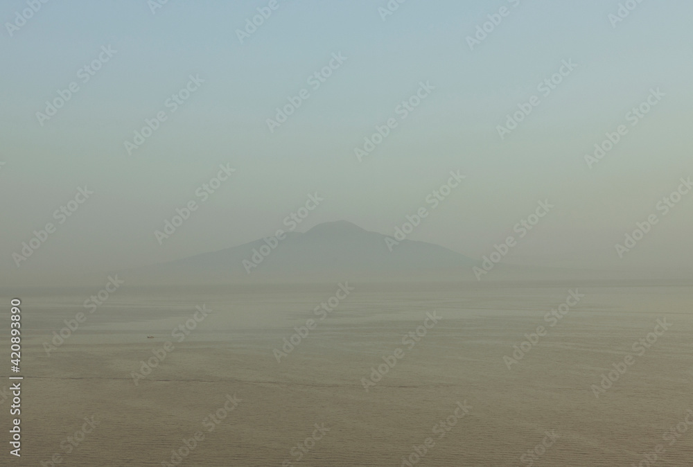 Distant misty view of Mount Vesuvius, Sorrento, Italy Distant misty view of Mount Vesuvius, Sorrento, Italy