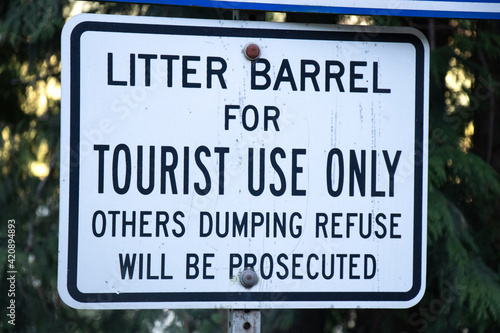 View of sign Litter Barrel for Tourist Use only, Others dumping refuse will be prosecuted in Strathcona Provincial Park